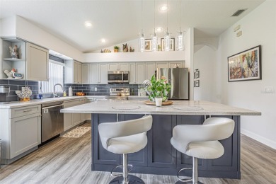 STUNNING REMODELED HOME, with over $40,000 in recent upgrades on Tampa Bay Golf and Country Club in Florida - for sale on GolfHomes.com, golf home, golf lot
