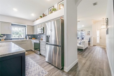 STUNNING REMODELED HOME, with over $40,000 in recent upgrades on Tampa Bay Golf and Country Club in Florida - for sale on GolfHomes.com, golf home, golf lot