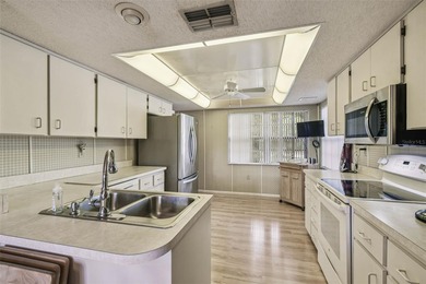 Welcome to this beautifully maintained 3-bedroom, 2-bath on Beacon Woods Golf Club in Florida - for sale on GolfHomes.com, golf home, golf lot