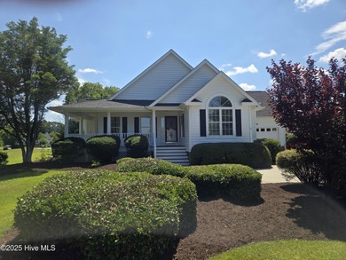This charming farmhouse-style home with wraparound porches on Ocean Ridge Plantation in North Carolina - for sale on GolfHomes.com, golf home, golf lot