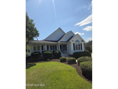 This charming farmhouse-style home with wraparound porches on Ocean Ridge Plantation in North Carolina - for sale on GolfHomes.com, golf home, golf lot