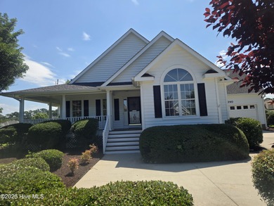 This charming farmhouse-style home with wraparound porches on Ocean Ridge Plantation in North Carolina - for sale on GolfHomes.com, golf home, golf lot