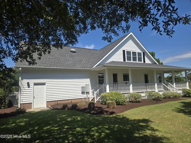 This charming farmhouse-style home with wraparound porches on Ocean Ridge Plantation in North Carolina - for sale on GolfHomes.com, golf home, golf lot