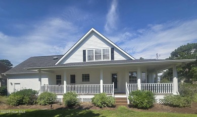 This charming farmhouse-style home with wraparound porches on Ocean Ridge Plantation in North Carolina - for sale on GolfHomes.com, golf home, golf lot