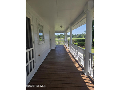 This charming farmhouse-style home with wraparound porches on Ocean Ridge Plantation in North Carolina - for sale on GolfHomes.com, golf home, golf lot
