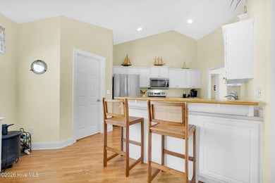 Light-filled, airy, and designed for easy coastal living, this on Harbour Point Golf Club in North Carolina - for sale on GolfHomes.com, golf home, golf lot