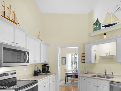 Light-filled, airy, and designed for easy coastal living, this on Harbour Point Golf Club in North Carolina - for sale on GolfHomes.com, golf home, golf lot