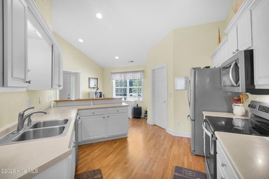 Light-filled, airy, and designed for easy coastal living, this on Harbour Point Golf Club in North Carolina - for sale on GolfHomes.com, golf home, golf lot