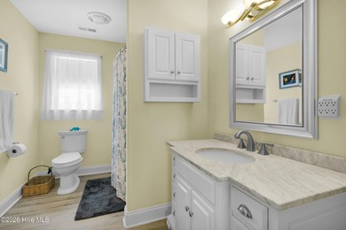 Light-filled, airy, and designed for easy coastal living, this on Harbour Point Golf Club in North Carolina - for sale on GolfHomes.com, golf home, golf lot