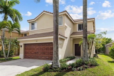 Beautifully maintained 5 bed, 2.5 bath home in the guard-gated on Weston Hills Country Club in Florida - for sale on GolfHomes.com, golf home, golf lot