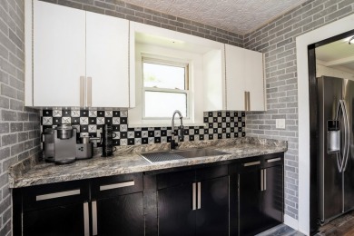 This charming South Side bungalow is full of character and some on Wakonda Club in Iowa - for sale on GolfHomes.com, golf home, golf lot