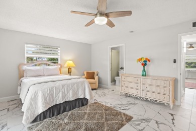 Charming, light-filled 1BR/1.5BA first-floor end unit nestled in on The American Golf Club in Florida - for sale on GolfHomes.com, golf home, golf lot