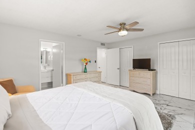 Charming, light-filled 1BR/1.5BA first-floor end unit nestled in on The American Golf Club in Florida - for sale on GolfHomes.com, golf home, golf lot