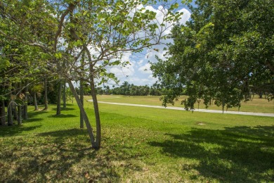 Charming, light-filled 1BR/1.5BA first-floor end unit nestled in on The American Golf Club in Florida - for sale on GolfHomes.com, golf home, golf lot