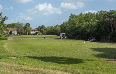 Charming, light-filled 1BR/1.5BA first-floor end unit nestled in on The American Golf Club in Florida - for sale on GolfHomes.com, golf home, golf lot
