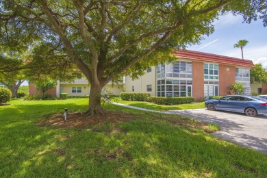 Charming, light-filled 1BR/1.5BA first-floor end unit nestled in on The American Golf Club in Florida - for sale on GolfHomes.com, golf home, golf lot
