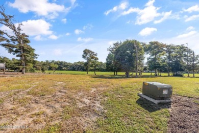 Discover your perfect beach escape in this hidden gem, nestled on Oak Island Golf Club in North Carolina - for sale on GolfHomes.com, golf home, golf lot