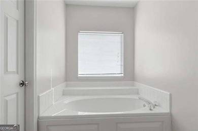 Welcome to easy living in the highly sought-after Bridgemill on Bridgemill Golf Club in Georgia - for sale on GolfHomes.com, golf home, golf lot