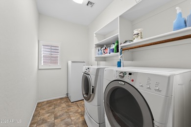 Stunning home, located within the gated Trilogy at Power Ranch on Trilogy Golf Club At Power Ranch in Arizona - for sale on GolfHomes.com, golf home, golf lot