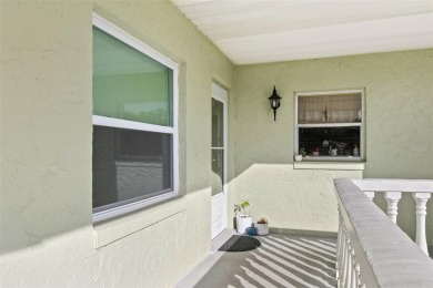 WELCOME TO THE GREEN DOLPHIN! This beautifully updated end-unit on Tarpon Springs Golf Course in Florida - for sale on GolfHomes.com, golf home, golf lot