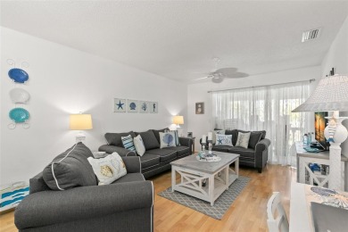 WELCOME TO THE GREEN DOLPHIN! This beautifully updated end-unit on Tarpon Springs Golf Course in Florida - for sale on GolfHomes.com, golf home, golf lot
