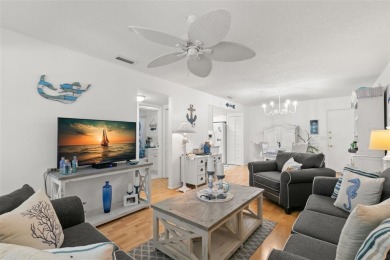 WELCOME TO THE GREEN DOLPHIN! This beautifully updated end-unit on Tarpon Springs Golf Course in Florida - for sale on GolfHomes.com, golf home, golf lot