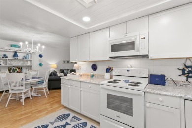 WELCOME TO THE GREEN DOLPHIN! This beautifully updated end-unit on Tarpon Springs Golf Course in Florida - for sale on GolfHomes.com, golf home, golf lot