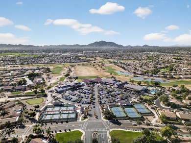 Stunning home, located within the gated Trilogy at Power Ranch on Trilogy Golf Club At Power Ranch in Arizona - for sale on GolfHomes.com, golf home, golf lot