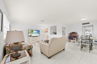 Enjoy lush garden and golf course views from this inviting on Kings Point Golf - Executive in Florida - for sale on GolfHomes.com, golf home, golf lot