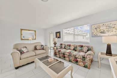 Enjoy lush garden and golf course views from this inviting on Kings Point Golf - Executive in Florida - for sale on GolfHomes.com, golf home, golf lot
