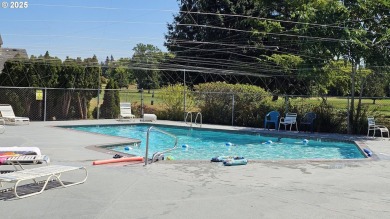 Wonderful property with air conditioning and a swimming pool on Gresham Golf Course in Oregon - for sale on GolfHomes.com, golf home, golf lot