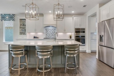 This popular Aubrey floor plan  is located on a quiet street on Wildhorse Golf Club of Robson Ranch in Texas - for sale on GolfHomes.com, golf home, golf lot
