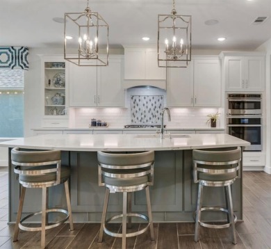 This popular Aubrey floor plan  is located on a quiet street on Wildhorse Golf Club of Robson Ranch in Texas - for sale on GolfHomes.com, golf home, golf lot