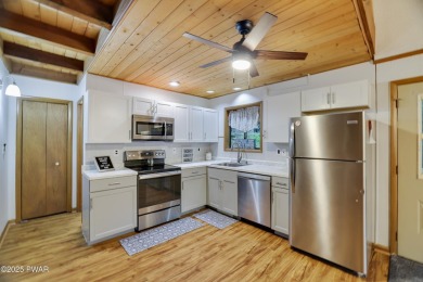Charming Chalet with OVERSIZED SCREENED-IN PORCH in Amenity-Rich on The Hideout Golf in Pennsylvania - for sale on GolfHomes.com, golf home, golf lot