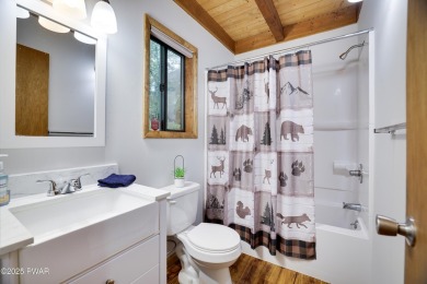 Charming Chalet with OVERSIZED SCREENED-IN PORCH in Amenity-Rich on The Hideout Golf in Pennsylvania - for sale on GolfHomes.com, golf home, golf lot