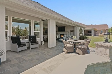 This popular Aubrey floor plan  is located on a quiet street on Wildhorse Golf Club of Robson Ranch in Texas - for sale on GolfHomes.com, golf home, golf lot