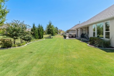 This popular Aubrey floor plan  is located on a quiet street on Wildhorse Golf Club of Robson Ranch in Texas - for sale on GolfHomes.com, golf home, golf lot