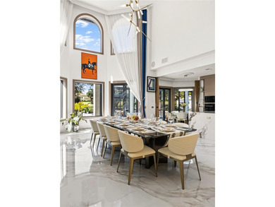 Presenting a newly remodeled luxury estate ideally positioned on Isleworth Golf and Country Club in Florida - for sale on GolfHomes.com, golf home, golf lot