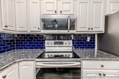 Welcome to this charming second-floor condo located in the on Kings Grant Golf and Country Club in North Carolina - for sale on GolfHomes.com, golf home, golf lot