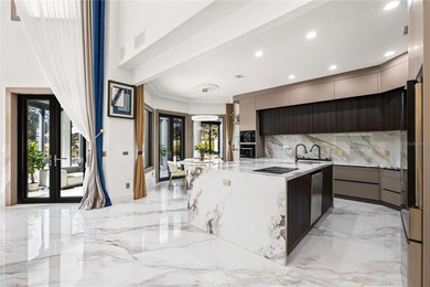 Presenting a newly remodeled luxury estate ideally positioned on Isleworth Golf and Country Club in Florida - for sale on GolfHomes.com, golf home, golf lot