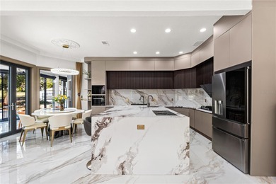 Presenting a newly remodeled luxury estate ideally positioned on Isleworth Golf and Country Club in Florida - for sale on GolfHomes.com, golf home, golf lot