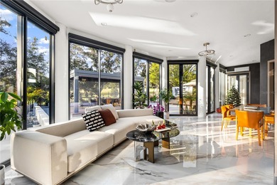 Presenting a newly remodeled luxury estate ideally positioned on Isleworth Golf and Country Club in Florida - for sale on GolfHomes.com, golf home, golf lot