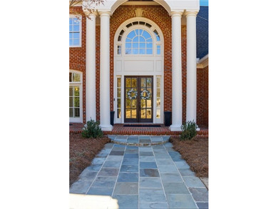 Welcome to your private retreat in the heart of Governors Towne on The Governors Towne Club in Georgia - for sale on GolfHomes.com, golf home, golf lot