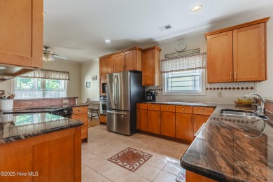 Welcome to this 4-bedroom, 3.5-bath home in the sought-after Sea on Sea Trail Golf Resort in North Carolina - for sale on GolfHomes.com, golf home, golf lot