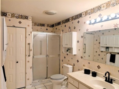 Fabulous,  beautifully maintained Twintree  with gorgeous lake on Caloosa Greens Executive Golf Course in Florida - for sale on GolfHomes.com, golf home, golf lot