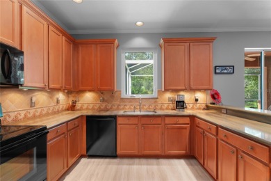 Discover the perfect blend of style, comfort, and privacy in the on Heritage Harbor Golf and Country Club in Florida - for sale on GolfHomes.com, golf home, golf lot
