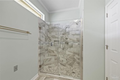 Located at 1456 Champions Green Drive in Gulf Breeze, Florida on Tiger Point Golf and Country Club in Florida - for sale on GolfHomes.com, golf home, golf lot