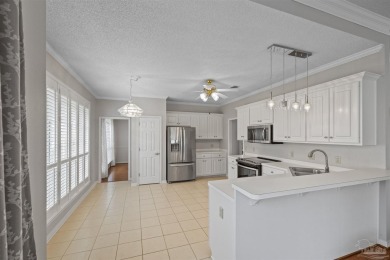 Located at 1456 Champions Green Drive in Gulf Breeze, Florida on Tiger Point Golf and Country Club in Florida - for sale on GolfHomes.com, golf home, golf lot