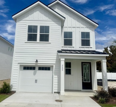 Fall in love with this move-in ready 4-bedroom, 2.5-bath home in on Tidewater Golf Club and Plantation in South Carolina - for sale on GolfHomes.com, golf home, golf lot