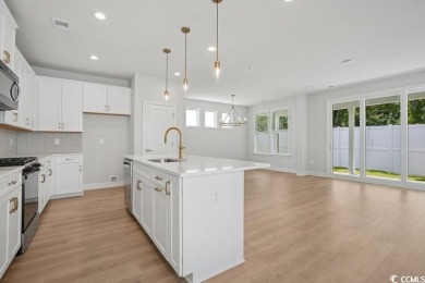 Fall in love with this move-in ready 4-bedroom, 2.5-bath home in on Tidewater Golf Club and Plantation in South Carolina - for sale on GolfHomes.com, golf home, golf lot